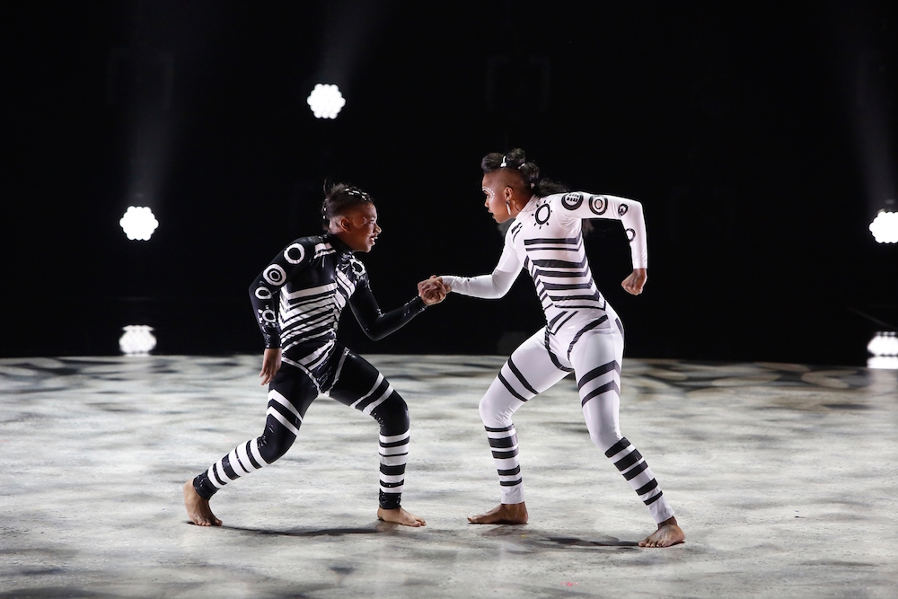 SYTYCD Top 4 contestant Kida Burns and all-star Sasha Mallory perform an African Jazz routine to “Din Daa Daa (Radio Edit)” choreographed by Sean Cheesman